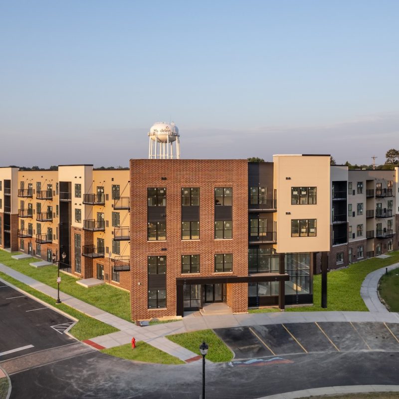 Station 250 apartment complex exterior showing modern multi-story buildings with landscaping in Mundelein IL