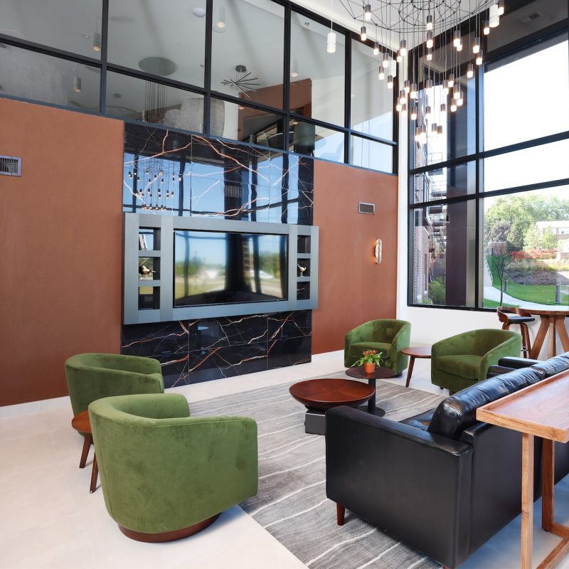 Station 250 community gathering space with comfortable seating, large windows, and social area design Mundelein IL