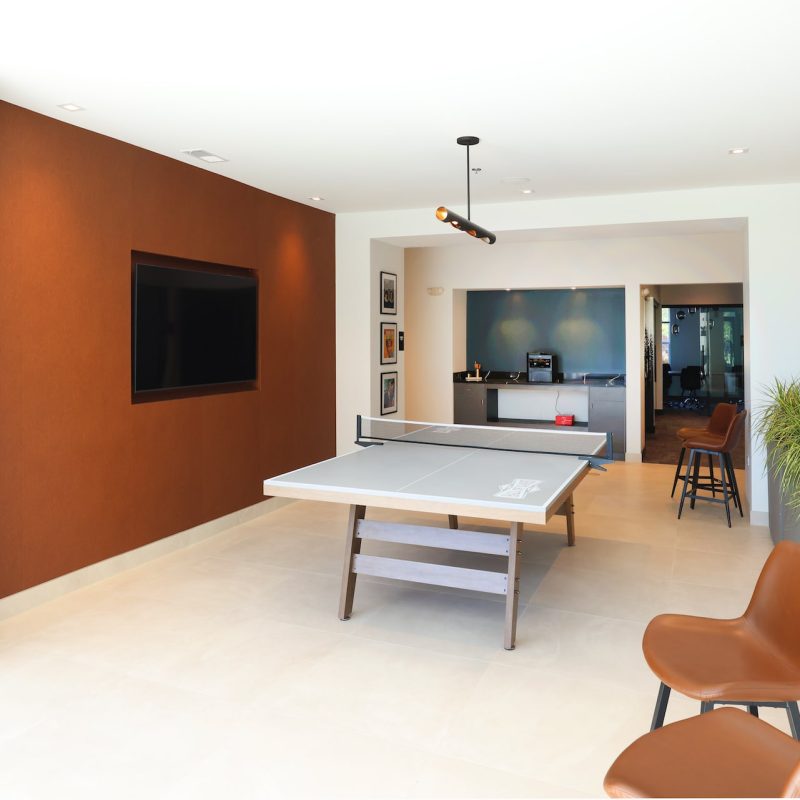 Station 250 game room with ping pong table and with comfortable seating, natural light, and welcoming design Mundelein IL