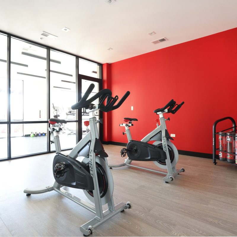 Station 250 yoga and fitness studio with red accent wall, mirrors, and open exercise space Mundelein IL