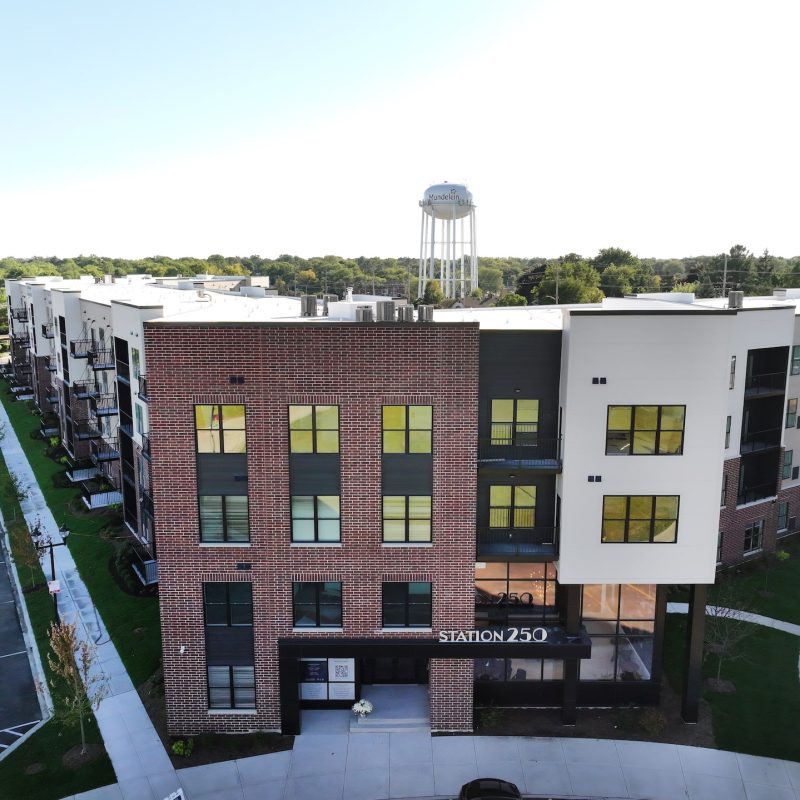 Station 250 apartment building corner view displaying contemporary architecture and balcony features in Mundelein IL