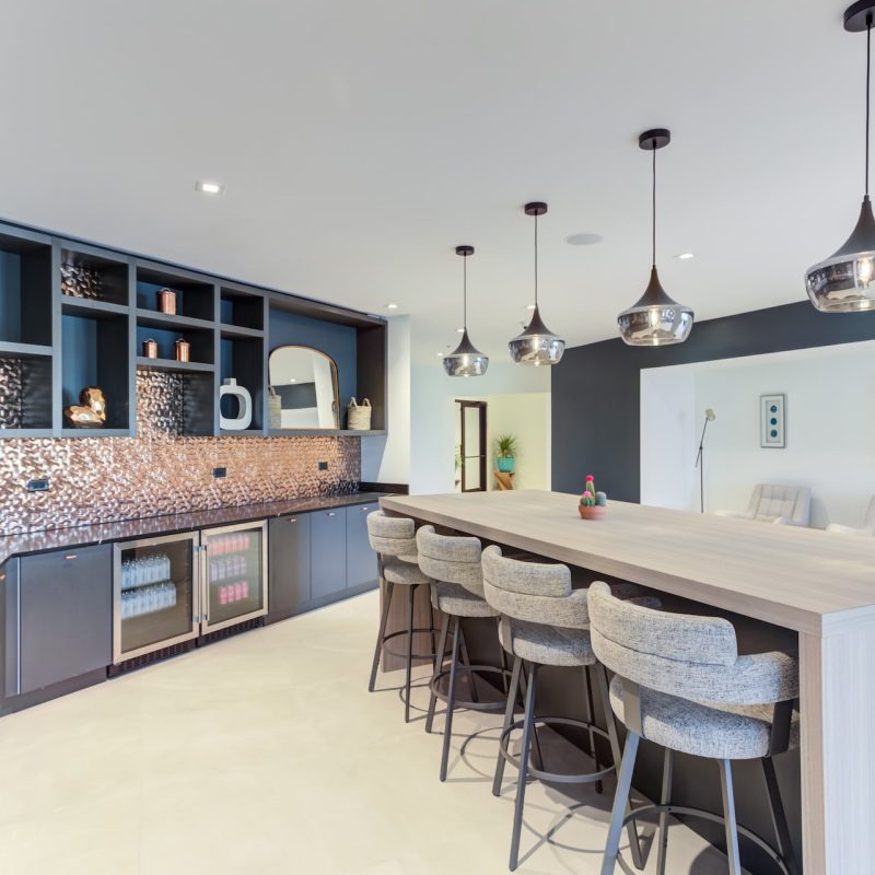 Station 250 community kitchen with modern appliances, bar seating, and open layout for resident gatherings Mundelein IL