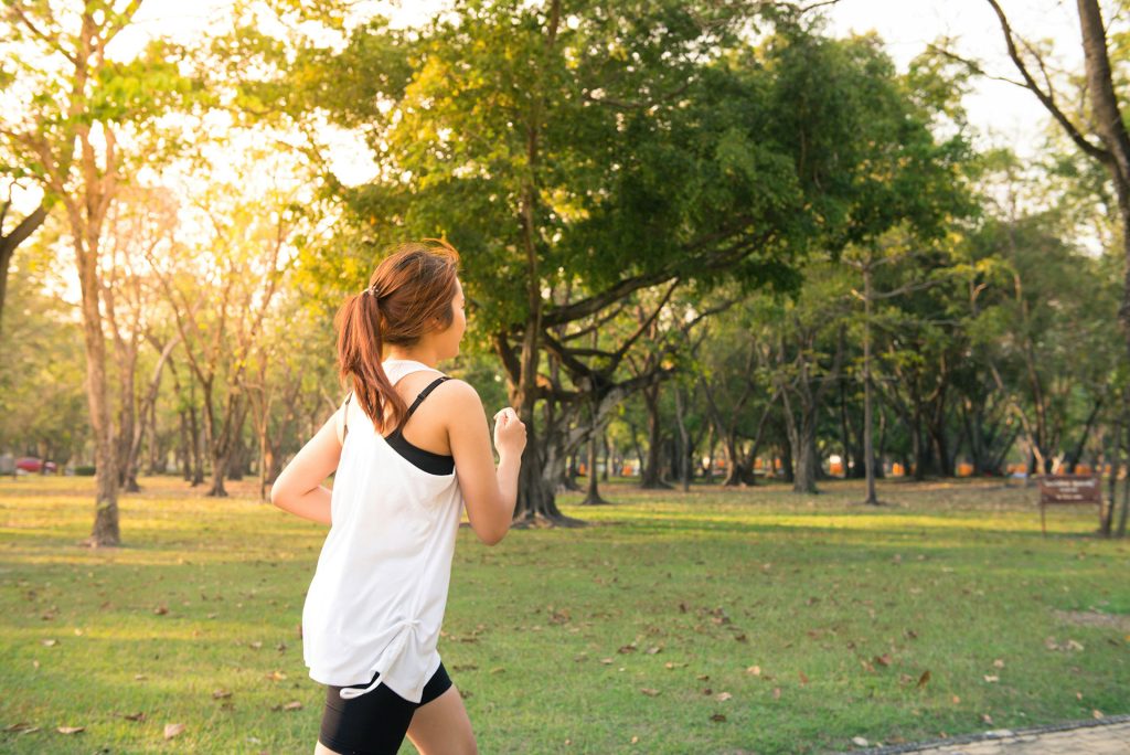 Woman running on trail